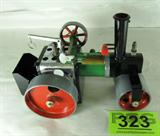 Die Cast Mamod Toy Steam Roller
Collectable die cast red and green Mamod toy Steam Roller manufactured in England. Measures 7" high and 10 " long. Some wear due to age and use. Add this unique piece to your collection.