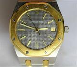Jewelry Audemars Piguet Royal Oak Watch*
Stately men's watch face reads "Audemars Piguet", back reads "Royal Oak Quartz". Heavy stainless steel and 18kt yellow gold band. Consignor states this watch has been checked by a jewelry and was told it is genuine. Total weight: 77.1 dwt.