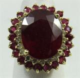 Jewelry 14KT Yellow Gold Ruby and Diamond Ring
Beautiful 14KT White Gold & Emerald Diamond Ring, size 5.5. Included American International Gemologists (AIG) Pre-Sale Estimated Retail & Gemological Report reads:
"One electronically tested 14KT yellow gold ladies cast diamond ring. Condition is new, good workmanship. The featured oval ruby is set with a tiered cluster of rubies and diamonds supported by lattice under gallery, completed by a two and a half millimeter wide band. Identified with markings of "K14". Containing:
One prong set oval mixed cut natural ruby, measuring 14.30 x 11.10 x 6.56mm, approximate weight of 8.57ct., clarity is heavily included, type II, dark, moderately strong, red color, (GIA R 7/4), cut is good. Transmitting light somewhat diffusely, transparent to translucent. Naturally occurring internal & external characteristics are present. Indications of laboratory high temperature heat treatment, with glass & flux additives. Colored Stone Grading Report attached. Gr