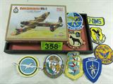 Mixed Lot Military Patches & Model Airplane Kit
A great collection of old military uniform patches and an unassembled model airplane kit. Lot includes:
- 1:144 scale Minicraft Model Kit, War Bird Series, Avro Lancaster MK-1 British aircraft. The cellophane has not been removed from this box.
- Military patches:
Strategic Air Command
Pease Air Force Base Sentry Dog Section
U.S. Navy VS-32
1968 Security Police - Revolver & Rifle Matches
Several others