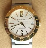 Jewelry Men's Bvlgari 18kt Gold & Stainless Watch*
Fabulous stately mid sized 18kt yellow gold and stainless steel watch made by Bulgari. Face reads "Bvlgari Automatic". Back reads: ACIER/OR 750 18k Bvlgari #BB 33 SG Auto D388366 Fabrique En Suisse". Shows subtle signs of wear. Comes with original box. Total weight: 72.7 dwt.