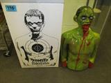 Zombie Bleeding Target "Rocky".It is filled with biodegradable matter, which makes clean-up so much easier…and let’s not forget, it oozes and burst into little pieces of blood soaked Zombie matter when you shoot it! Includes stake as prop. New in box