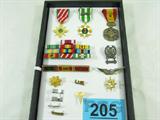 Collection of US Military Medals & Badges:
- 3 Vietnam era medals
- Vietnam service & award ribbons and Presidential Ribbons
- Rank Insignias: 2nd LT to LTC
- Aviator wings
- Medical Corps insignia