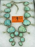 Jewelry Large Kingman Turquoise Sq. Blossom
This stunning squash blossom necklace is Sterling Silver, from top to bottom, and adorned with beautiful Kingman Turquoise cabochons. An extremely large Squash Blossom Necklace. Consignor stated that this is the largest Kingman Turquoise Necklace known. Vintage indian crafted necklace. Priced at $4800.00 in the 1970's. Center piece is 4.5" across and stones measure aprox. 1" each. Stones around necklace measure from over 2" across down to 1.5" across. 17 Stones total. A stunning one of a kind piece!