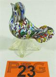 Murano Art Glass Millefiori Bird Figurine
A superb example of hand crafted Italian art glass is what you'll find with this Millefiori bird figurine which sits atop gold fleck flower petals. The piece is not signed but appears to be authentic Murano glass. No chips, breaks or cracks. Measures approximately 4.5" tall x 3.75" across.
