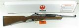Ruger Model Mini 14 in 223 Semi Auto Rifle. Features peep sights, stainless action, brushed stainless finish, rings included for future optic. Deluxe flat matte finish on deluxe walnut wood, detachable 5 round magazine for hunting applications and or target shooting. New in box.