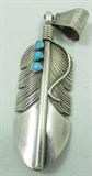 Jewelry Sterling Silver Feather Pendant
Beautiful Southwestern style sterling silver feather shaped pendant, accented with three small turquoise stones. Pendant has lovely detail! Marked / signed "charley sterling", measures: 3.25" long. Total weight: .76 ozt.