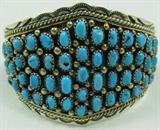 Jewelry Large Sterling & Turquoise Cuff Bracelet
Fabulous large sterling silver Southwestern style cuff bracelet featuring over 50 sawtooth set turquoise stone nuggets with lovely twisted rope design border. Marked / signed "sterling", measures: 5.5" wide with 1.5" opening. Total weight: 1.35 ozt.