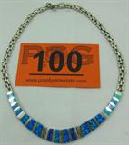 Jewelry Sterling Silver Opal Collar Style Necklace
Beautiful sterling silver collar style necklace featuring inlaid vibrant blue opal stones. Marking is illegible, measures approx: 16" long. Total weight: 1.70 ozt.