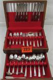 Homes & Edwards Silverplate Flatware & Chest
A beautiful service for 8 silverplate flatware set, each piece stamped Homes & Edwards Inlaid. Lot includes a wooden storage chest with red felt lining. Flatware:
- 8 dinner knives, 9.25" long.
- 8 dinner forks, 7.5" long.
- 8 salad / dessert forks, 6.75" long.
- 16 teaspoons, 6" long.
- 8 soup spoons, 7.25" long.
- 8 ice tea spoons, 7.75" long.
- 6 serving spoons, 8.5" long.
- 1 butter knife, 6" long.
- 1 sugar spoon, 6" long.
- 1 gravy ladel, 6.25" long.
- A pair of gold color tongs that does not match the set.