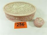 Lot of 2 Pink Incolay Jewelry / Trinket Boxes
This lot includes the following Incolay style pink stone jewelry / trinket boxes.
- A small octagon shaped box with removable lid and a lovely raised rose design on the lid. Measures 1.5" tall with a 2.5" diameter.
- An oval hinged lid box with extremely detailed floral and long tailed bird designs on the lid. Measures 3" tall x 10" across x 6.5" in depth.
