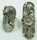 Jewelry Lot of 2 Sterling Silver Fashion Rings
Lot of 2 beautiful Southwestern style fashion ring featuring intricate metal work.
- Ring with tow feather designs, marked / signed "sterling morningstar", ring size: 9.
- Large ring with several feather designs and flower center, marked / signed "sterling RS", ring size: 6.25.
Total weight: .75 ozt.