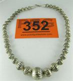 Jewelry Vintage Sterling Silver Bead Necklace
A gorgeous sterling silver bead necklace with a hook clasp. Measures 18" long.
Total weight: 1.4 ozt.