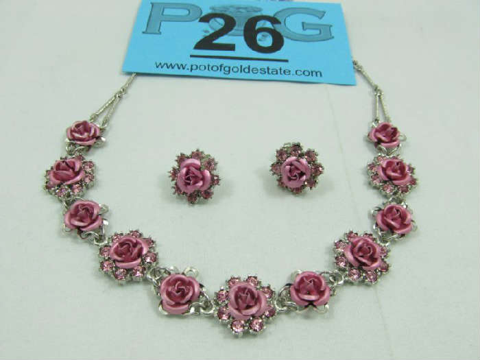 Jewelry Avon Pink Rose & Rhinestone Necklace Set
Beautiful silver toned choker style costume necklace and pierced earrings set, featuring pink roses and rhinestones. Marked "Avon", necklace measures: 14.5" - 17.5" long.