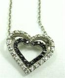 Jewelry Sterling Silver Heart Pendant Necklace
Beautiful sterling silver necklace with double heart shaped pendant accented with clear and black gemstones. Marked "925", measures: 18" long.