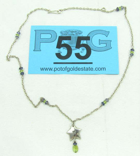 Jewelry Far Fetched Star Sterling Necklace
Lovely sterling silver necklace with blue and green beads, featuring a star shaped pendant. Marked "Far Fetched sterling", measures: 18" long. Total weight: .17 ozt.
