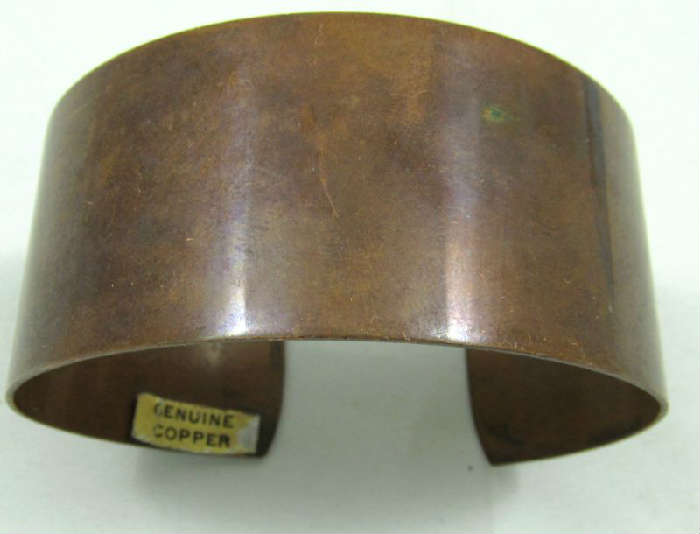 Jewelry Thick Copper Cuff Bracelet
Stately thick banded cuff bracelet made of copper. Has sticker marked "Genuine copper", measures: 6.5" wide with 1" opening.