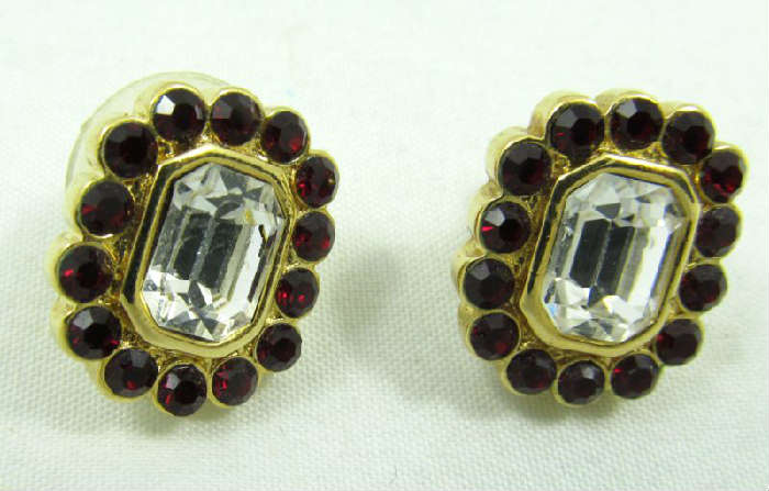 Jewelry Trifari Rhinestone Stud Earrings
Lovely gold toned Trifari costume earrings accented with red and clear rhinestones. Pierced stud style earrings, marked "Trifari".