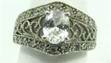 Jewelry Cubic Zirconia Fashion Ring
Gorgeous silver toned or plated fashion ring featuring sparkly Cubic Zirconia stones and filigree design. Unmarked, ring size: 8.