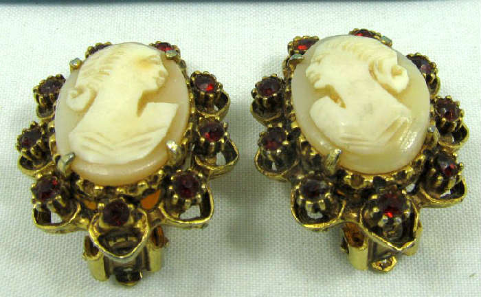 Jewelry Vintage Cameo Clip On Costume Earrings
Beautiful vintage clip on cameo earrings with antique style design, accented with red rhinestones. Unknown age and maker.