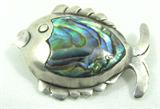 Jewelry Sterling Silver Abalone Fish Brooch
Darling sterling silver fish shaped figural brooch accented with abalone shell. Marked "925", measures: 1" long. Total weight: .09 ozt.