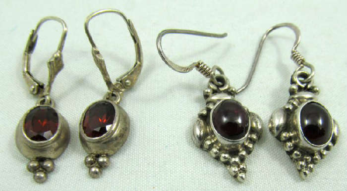 Jewelry Lot of 2 Sterling Silver Dangle Earrings
Beautiful sterling silver dangle style earrings featuring brown / orange colored gemstones. Both marked "925", total weight: .25 ozt.