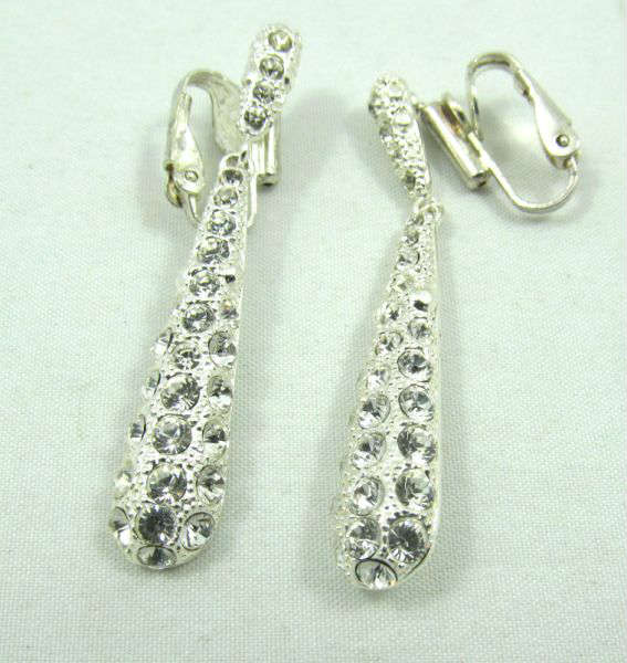 Jewelry Rhinestone Fashion Clip on Earrings
Gorgeous silver toned fashion rhinestone covered fashion dangle style clip on earrings. Measures: 2" long.