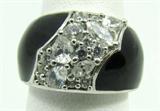 Jewelry Sterling Silver Onyx & CZ Fashion Ring
Gorgeous sterling silver fashion ring featuring inlaid black stone, possibly onyx as well as sparkly Cubic Zirconia stones. Marked "925", ring size: 7. Total weight: .19 ozt.