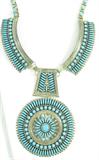 Lot#: 135
Description: Jewelry Sterling Petit Point Turqu Necklace Begay
Outstandingly gorgeous, and LARGE, sterling silver necklace with Southwestern style design featuring delicate petit point and round turquoise stones. Necklace has beautiful workmanship. Signed / marked in multiple places: "F.M Begay Navajo R0921412". Measures: 20" long, round pendant measures: 3.5" diameter. Total weight: 4.51 ozt