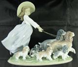 Lot#: 398
Description: Large Lladro "Puppy Parade" Porcelain Figurine
Magnificent vintage "Puppy Parade, Model No. 06784” Lladro porcelain figurine from the exclusive Privilege Collection. This statuette depicts a cute little girl walking her two adult cocker spaniel dogs on gold toned chains, followed by 5 playful puppies. Figurine is marked "Lladro Privilege, JD 66 J, hand made in Spain, Daisa 2000" on the bottom. Figure is in wonderful condition! Original box included, but shows some signs of wear and has some writing. Figurine measures: 12.5” wide x 9.5" tall. Comes from a smoke free home!