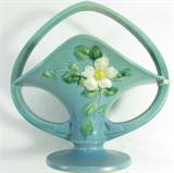 Lot#: 7
Description: Vintage Roseville Pottery "White Rose" Blue Basket
Very nice Art Deco style Roseville Pottery White Rose, blue basket with handle. Factory original condition with no chips, cracks, damage, or repair of any kind. No visible crazing. Bottom marked Roseville, USA and 363-10. Basket is 10 1/2" tall and 10" wide.
From the internet: “White Rose was a late period pattern introduced by Roseville Pottery in 1940. Standard colors include blue, pink, and brown. White Rose was marked with raised Roseville script marks, shape number, and size. There are 56 White Rose shapes in the factory stock pages, including vases, bowls, cornucopias, jardinières, etc.”
Z14 EAK