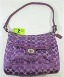 Lot 2
Description: Authentic Coach Penelope Signature Hobo Purse
Designer Coach Penelope Signature Sateen Convertible Soho, Hobo shoulder bag. This purse features the signature jacquard sateen fabric in purple with matching purple leather trim and white stitching. It has a silver metal zippered top closure and front pouch with twist lock, 32” shoulder drop, strap with leather dog-tag accessory. The inside is lined with a silver sateen fabric and has a zip pocket, and two cell phone / multi-function pockets. The leather label inside indicates it is style No. D1269-F19232 . It is in great gently used, pre-owned condition, the inside is clean and dust / lint free. The outside has a little wear at the bottom corners but no rips, tears or stains. Measures 13" wide x 11" tall. Consignor states this is a genuine Coach bag.
ZB989 EAK