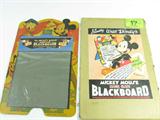 Lot#: 17
Description: Vintage Walt Disney, Mickey Mouse Magic Slate Toy
Awesome vintage Walt Disney, Mickey Mouse Magic Slate Blackboard toy. Manufactured exclusively by The Strathmore Company, Aurora, Illinois; it features a "magic slate" instead of a regular blackboard. "Simply write with stylus....than lift films. No chalk, no erasers, no dust, no dirt. New tracing feature - plus drawing, games etc. More than 50 Walt Disney cartoons to copy". In great condition for its age! Still in original cardboard envelope, it has a rigid cardboard hinged stand on the back like an easel for easy use. It has a couple small areas where the picture has worn but still has the original wood stylus (pen), plus drawing and tracing cards depicting Donald Duck, Mini, Goofy, Pluto, Snow White and the 7 Dwarfs plus many more! Measures 18.5" tall x 12" wide.
Z14 EAK