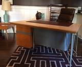 Raymond Loewy,  Mid-Century, Suspended Wood Pedestal & Metal Desk, Laminated Top by Brunswick; Eames Soft Pad Executive Chair; Brown Saltman Lamp Table;