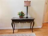 Henrdon entry table, floral arrangement and tall table lamp.