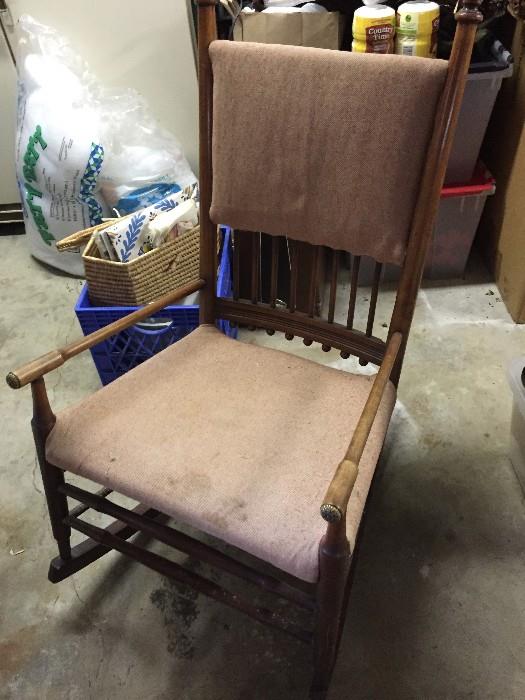 Antique rocking chair with medallion capped arms and legs