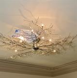  Chrome Tree Branch Light Fixture as seen while installed and lit. This fixture has been removed and will be for sale. 