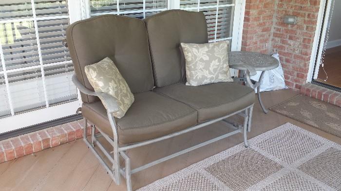 Rocker/glider with cushions and extra cover