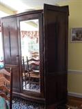 CLOTHING CABINET i n oak, antique with center mirror.