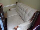 Vintage love seat. Fabric looks to be in good shape or just re-upholster it.  