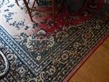 Dining room rug. A little worn in places but still has some life in it.