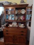 Cherry wood china cabinet with Noritake china and more.