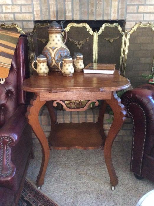 Sweet golden oak parlor table on porcelain castors
