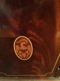 AN UP CLOSE OF THE EAGLE INLAY