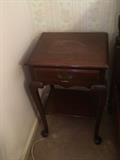 on of a pair of mahogany bedside tables
