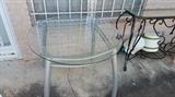 modern table with glass top...has four great bleach chairs that go with it...great black iron credenza with glass top