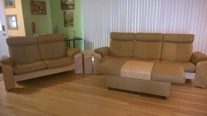 Couch and Loveseat from Dania Furniture (Stressless Brand) both recline, includes Ottoman with storage and center table (see other photos)