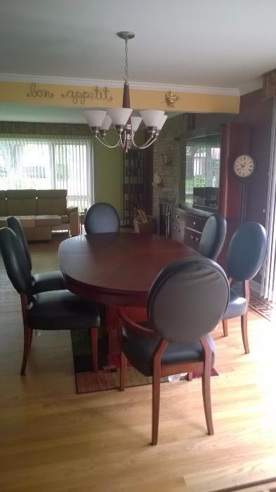 Cherrywood Oval Dining Room Set includes 6 chairs (2 are armchairs), with matching leaf.