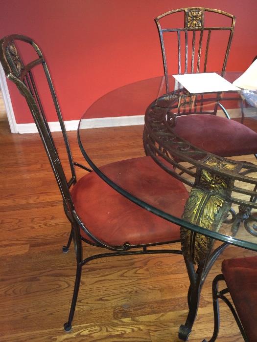 Iron and glass table with six chairs and matching baker's rack
