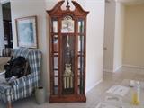 Howard Miller tall case with curio cabinet sides - this is currently in great working condition